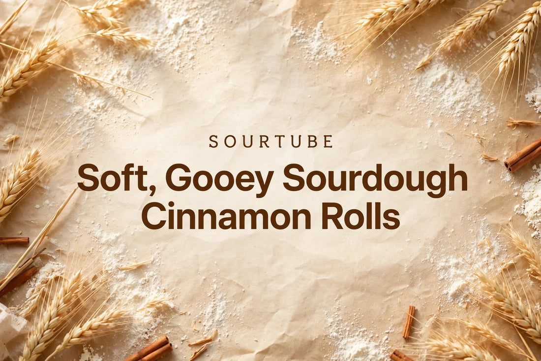 SourTube featured image: Soft, Gooey Sourdough Cinnamon Rolls title on a warm bakery background with wheat and cinnamon
